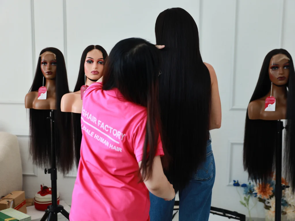 Professional hairstylist holding authentic Vietnamese hair types, ensuring high quality.