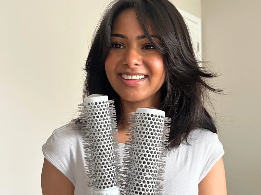Blow drying with a round brush on natural black hair