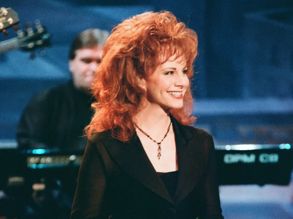 Does Reba McEntire Wear a Wig? The Secrets Behind Her Hair 3 Reba McEntire rocked voluminous, glamorous wigs